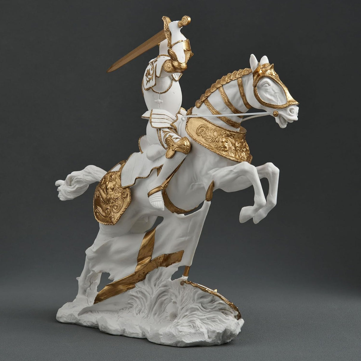 Statue of a knight on horseback with armor and sword, white and gold color scheme.