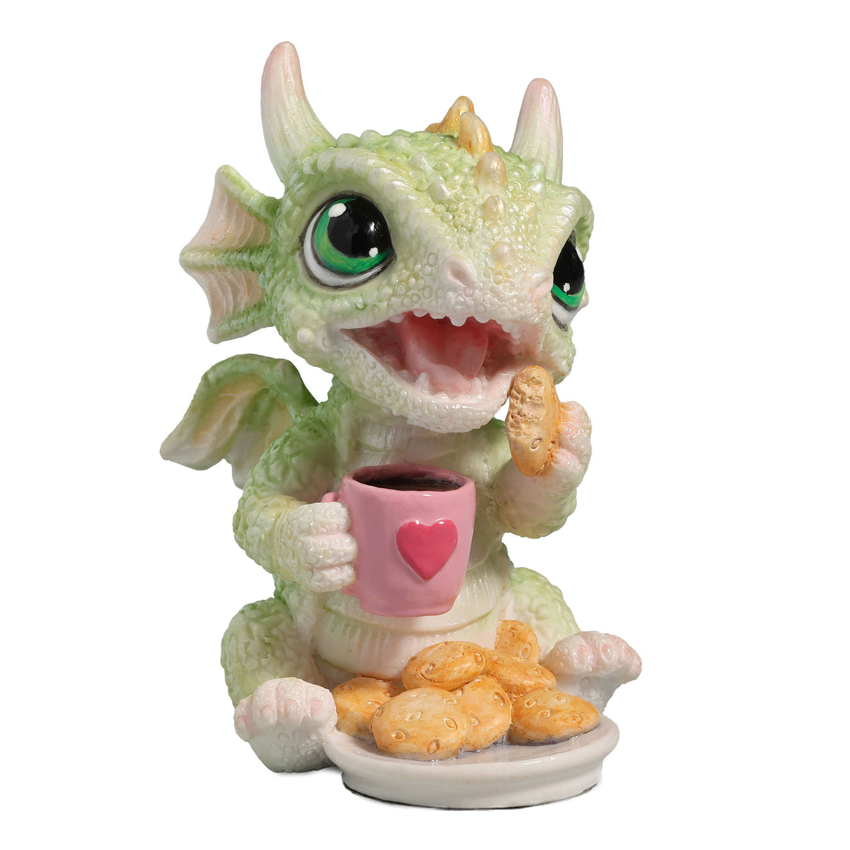 Figurine of a green baby dragon with a pink heart mug and plate of cookies