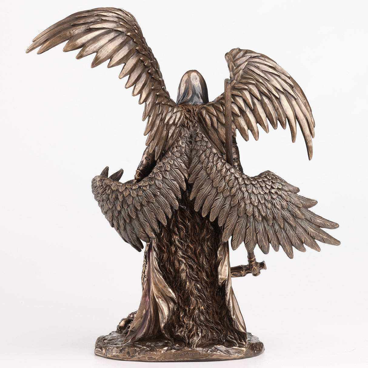 Figurine of Azrael, archangel of death - four wings to either side, clad in gold-accented armor in cold cast bronze, holding a scythe and skulls at his feet, shown from the back - feathered wings are detailed