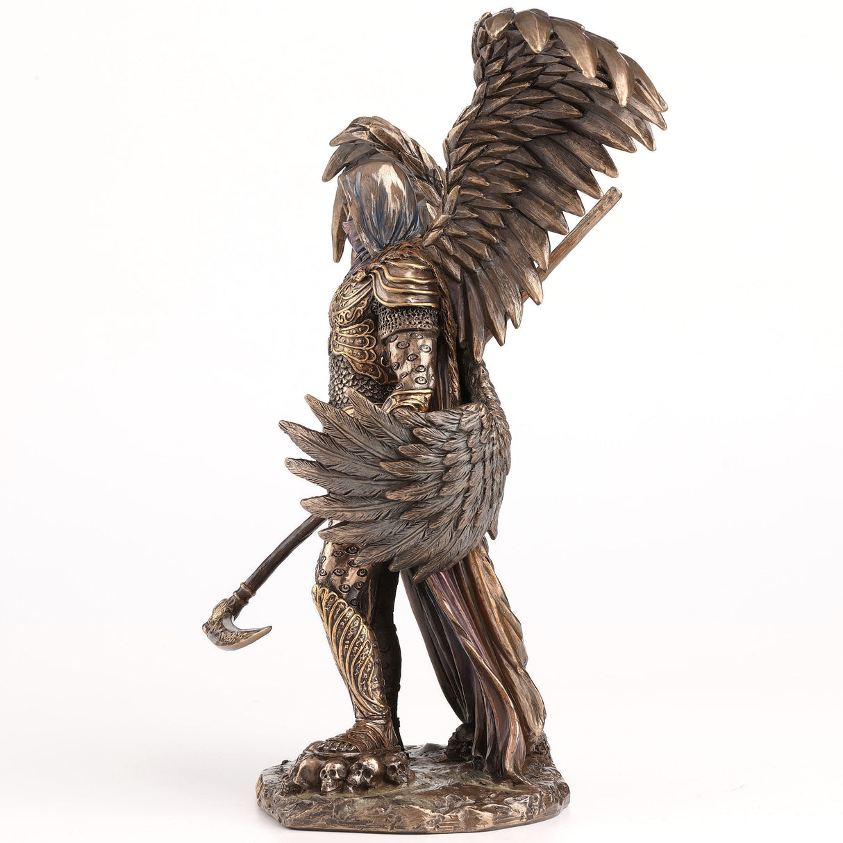 Figurine of Azrael, archangel of death - four wings to either side, clad in gold-accented armor in cold cast bronze, holding a scythe and skulls at his feet, shown from the side