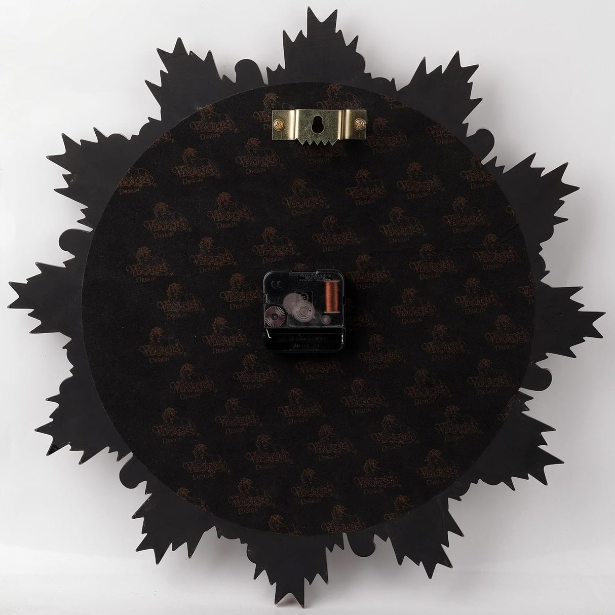 Back of wall clock showing mechanism and hanging hardware