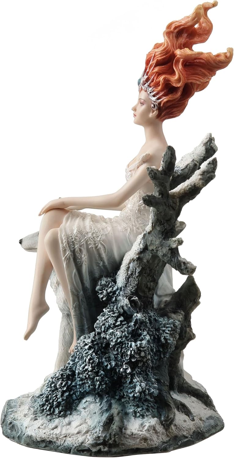 Statue of woman in white dress with red hair sitting on tree in winter landscape with a wolf, shown from the side