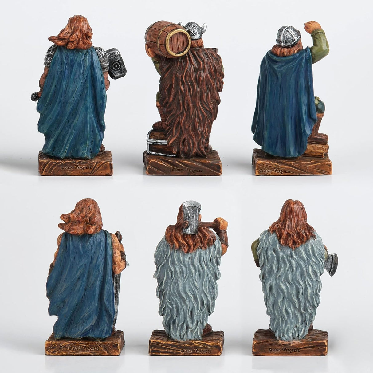 Set of six decorative Viking figurines in various poses with weapons, shown from the back
