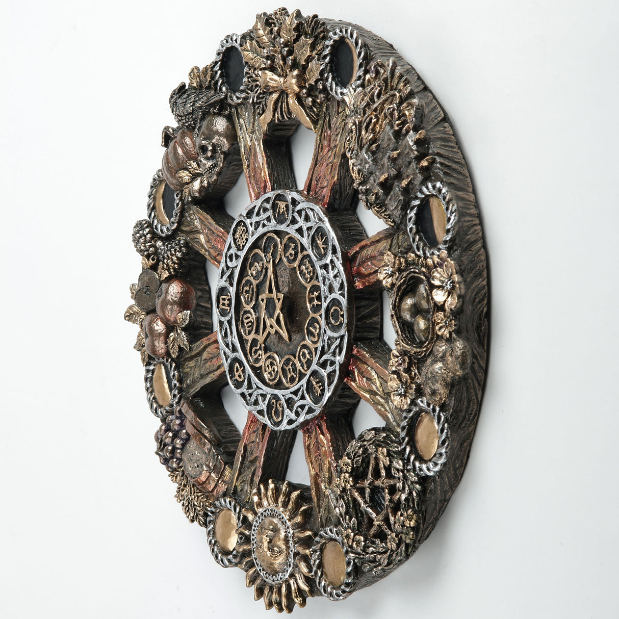 An ornate circular occult wheel wall plaque featuring a central pentagram and astrological symbols, surrounded by detailed seasonal elements including harvest food, plants and animals, and moon phases.