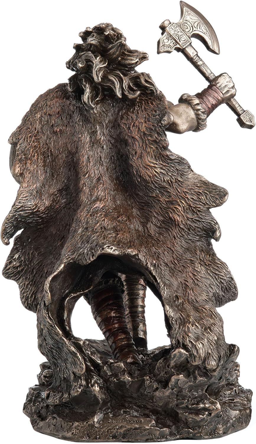 Statue of a Viking warrior holding a shield and axe, shown from the back animal skin cloak