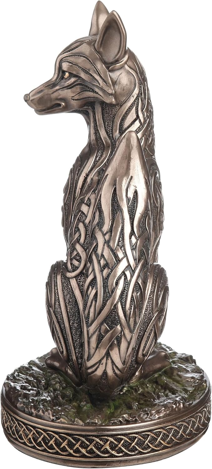 Bronze fox figurine with intricate Celtic knot patterns on a white background