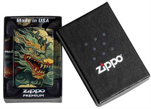 Zippo lighter with dragon design in packaging next to Zippo logo on black box