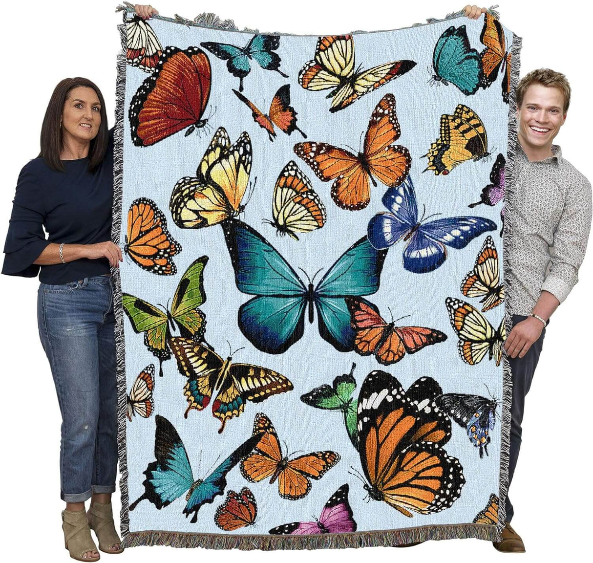 Tapestry blanket held by two adults to show large size