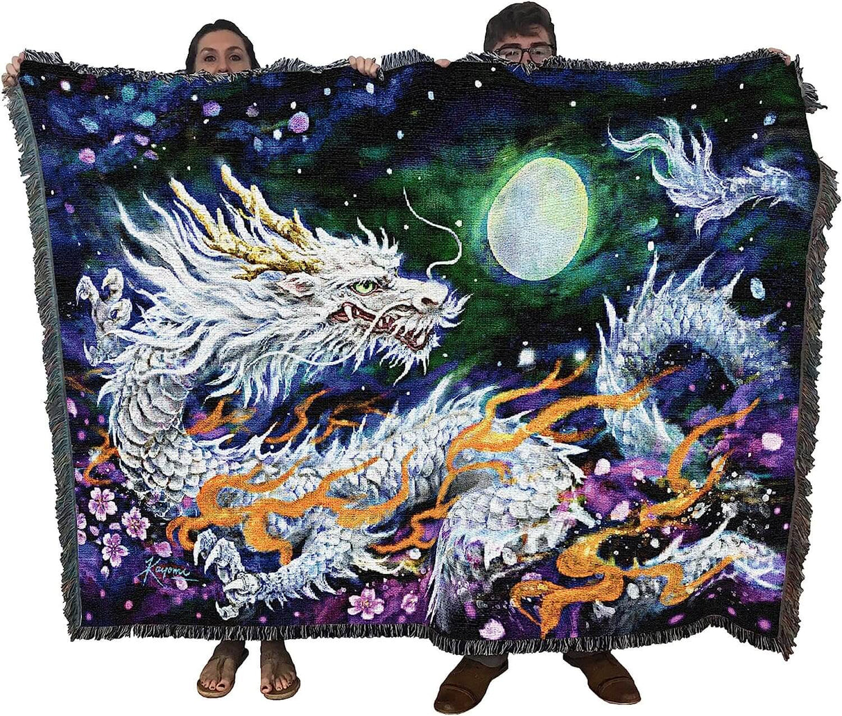 Tapestry blanket held up by two adults to show large size