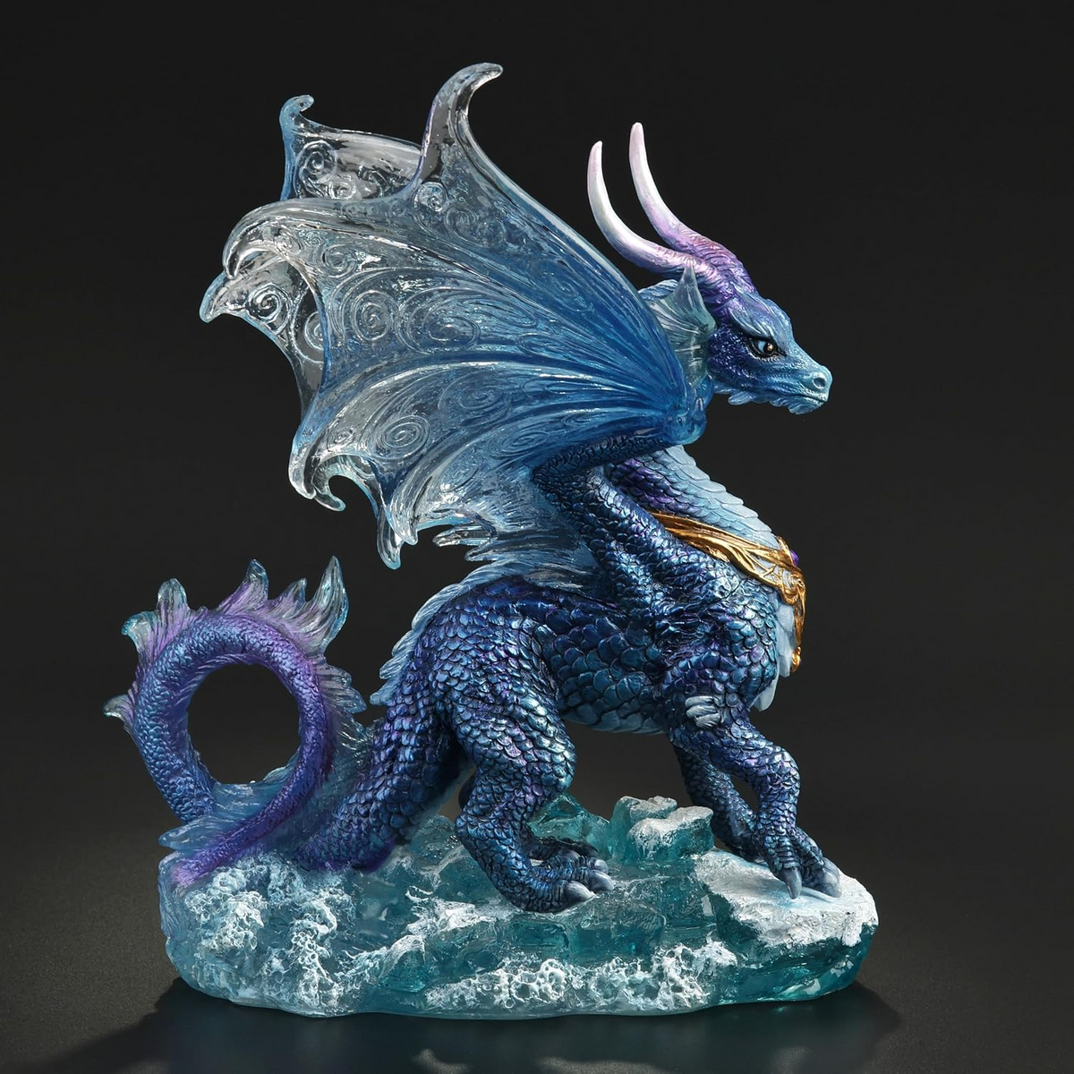 Figurine of blue dragon standing in the ocean waves