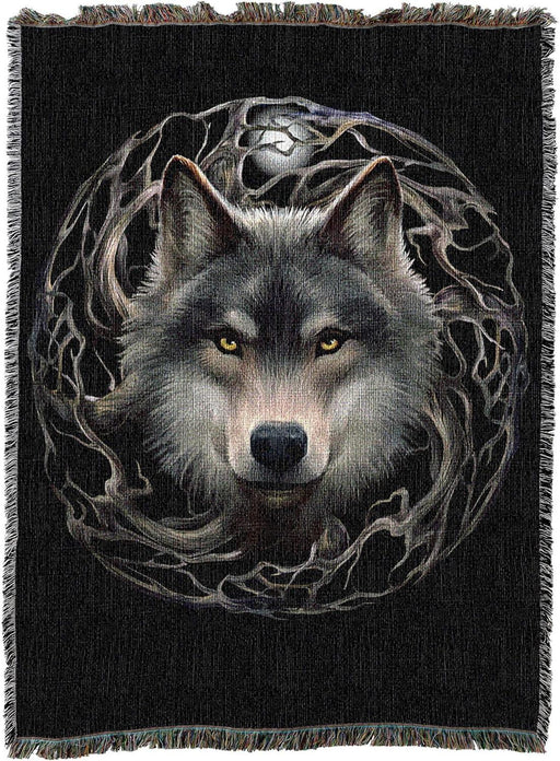 Tapestry blanket with background in black, showing wolf face at the center of a circle of tree branches with a full moon