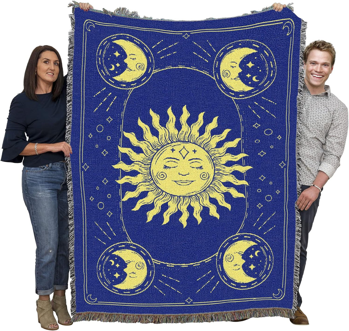 Woven tapestry with sun and moon design in yellow on a blue background, held up by two adults to show large size
