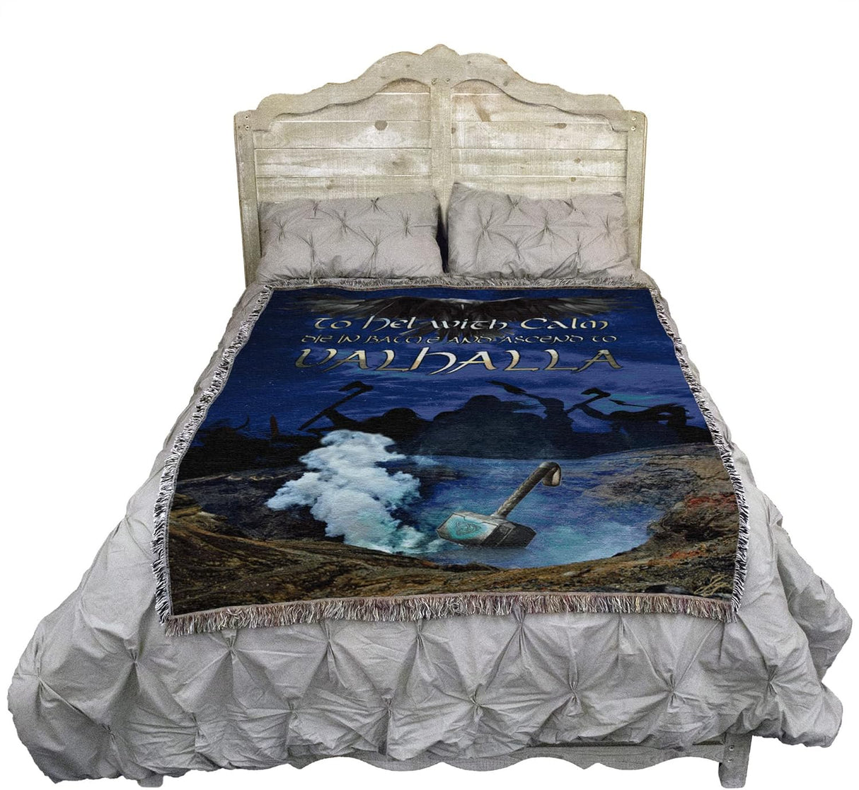 Tapestry blanket, blue background, raven, silhouette of warriors, Mjolnir hammer and words "To Hel with Calm, Die in Battel and Ascend to Valhalla" shown on a bed