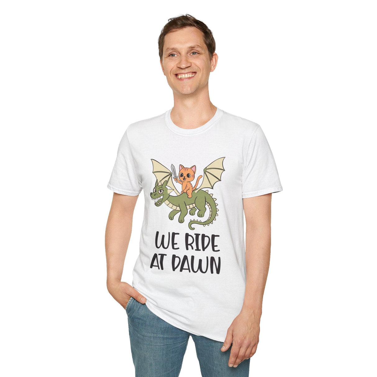 Person wearing white t-shirt with a cat riding a dragon graphic and 'We Ride at Dawn' text