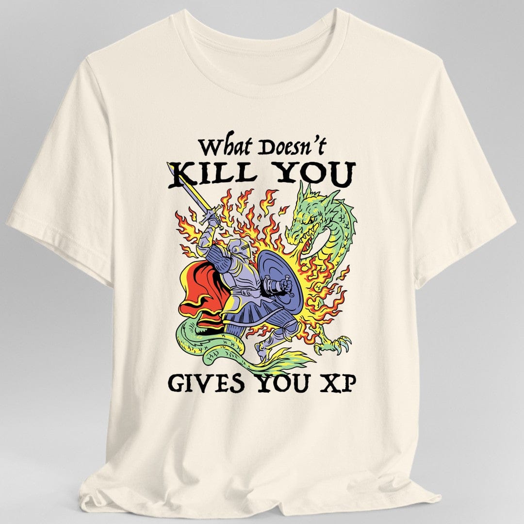 Natural/off white t-shirt with a graphic design of knight fighting a dragon and text reading "What Doesn't Kill You Gives You XP"