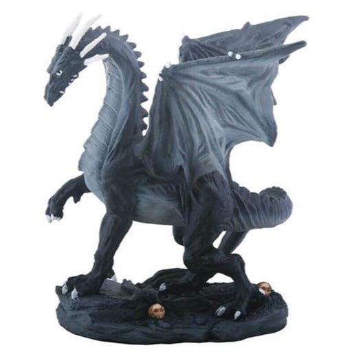 Figurine of a black dragon with white horns walking on rocky ground with skulls