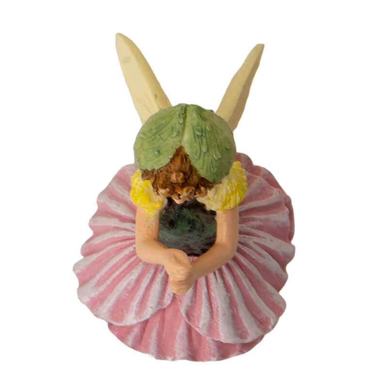 Cicely Mary Barker Flower Fairy Figurine dressed in a poppy blossom of pink and green with pale yellow wings