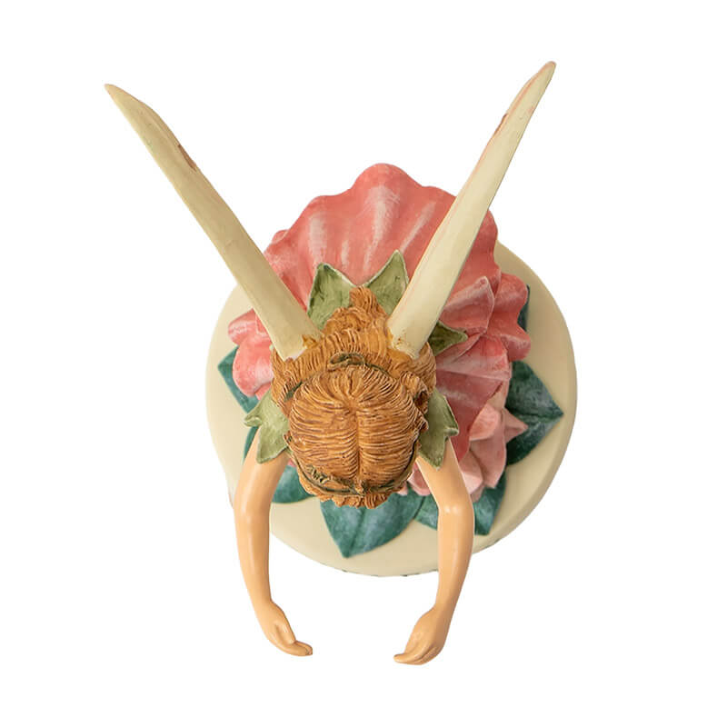 Flower fairy figurine of girl pixie with green and pink flower dress, base reads "Sweet Pea Fairy"