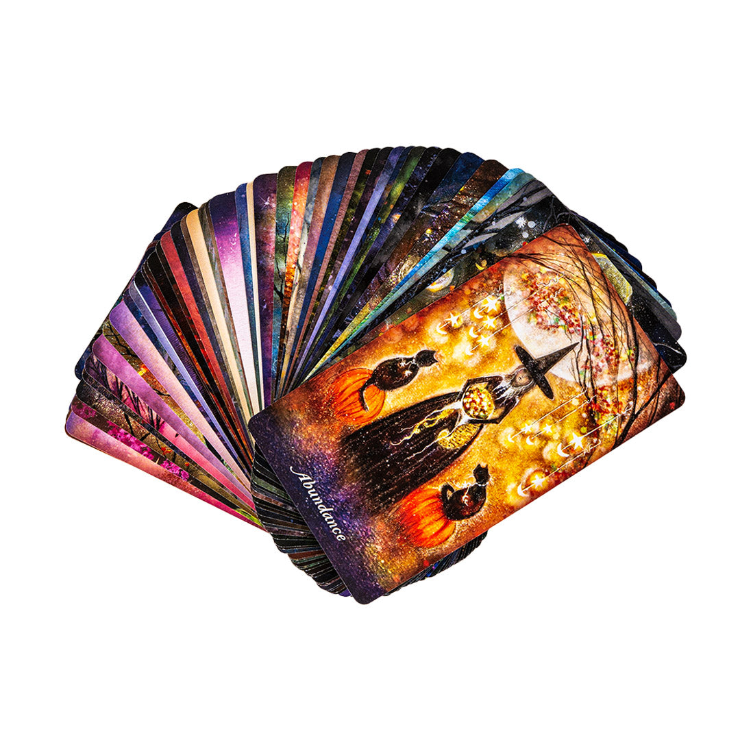 Set of oracle cards with colorful witchy designs on a white background
