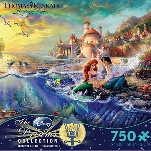 750 Piece Jigsaw Puzzle, Artwork by Thomas Kinkade. Ariel and Prince Eric spend time at the shore where ocean meets land in this Little Mermaid scene!