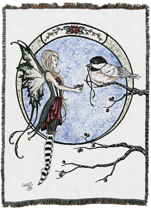 Tapestry blanket with art by Amy Brown featuring a fairy and a chickadee exchanging gifts in a winter scene