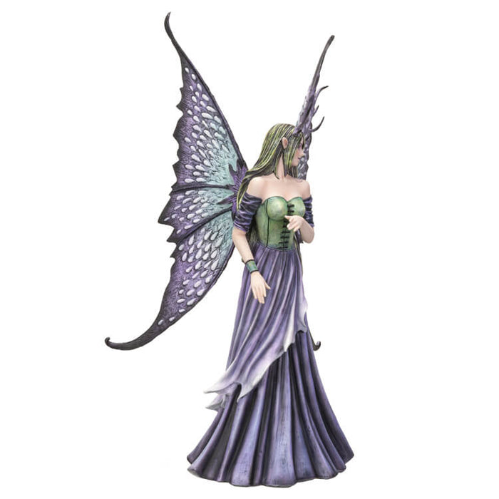 Large fairy figurine in shades of blue, purple, green and teal. Fairy has spotted wings, long hair and antlers. Shown from the side - she appears to be twirling, the fabric of her dress in the air