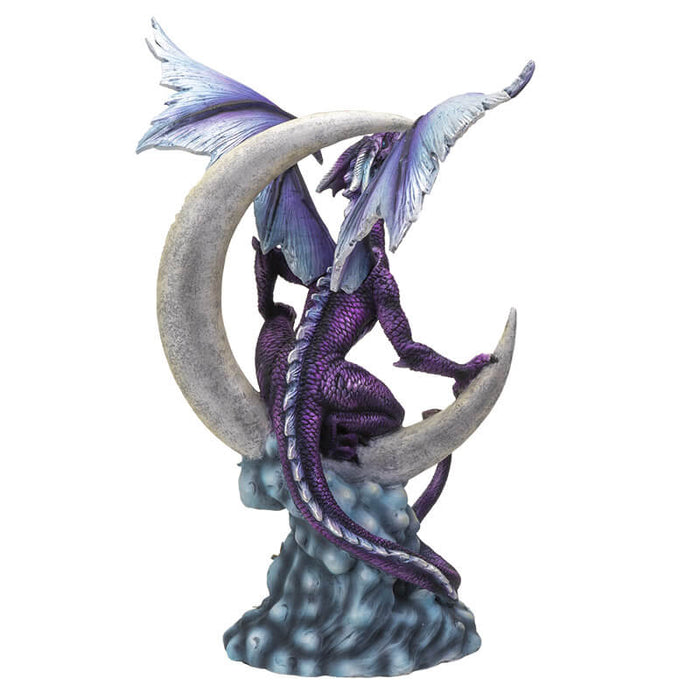 Purple dragon perched on a crescent moon with silver stars and blue clouds. Shown from the back. Dragon has light lavender spines down its back and wings to match.