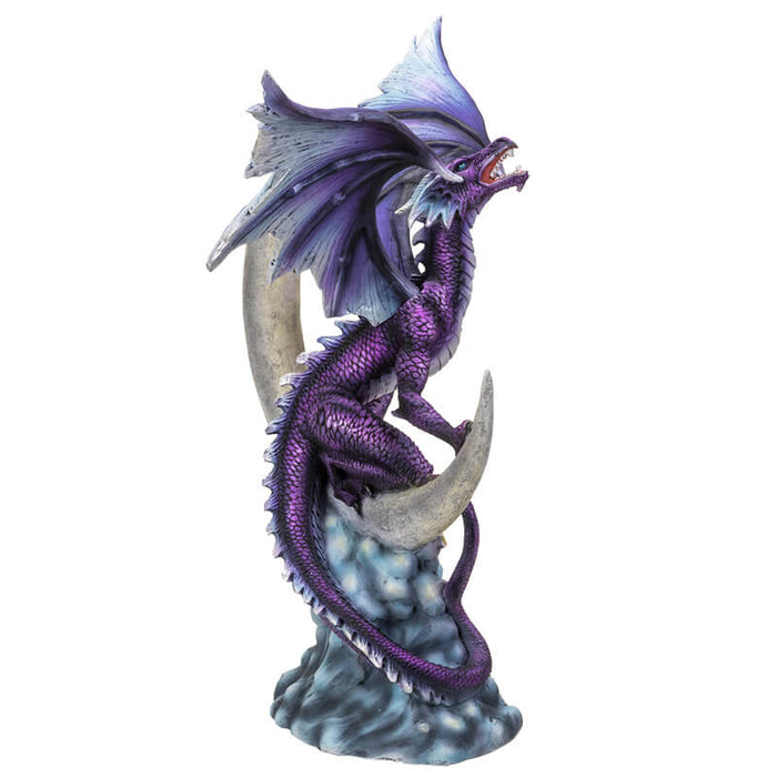 Purple dragon perched on a crescent moon with silver stars and blue clouds. Shown from the side-back.