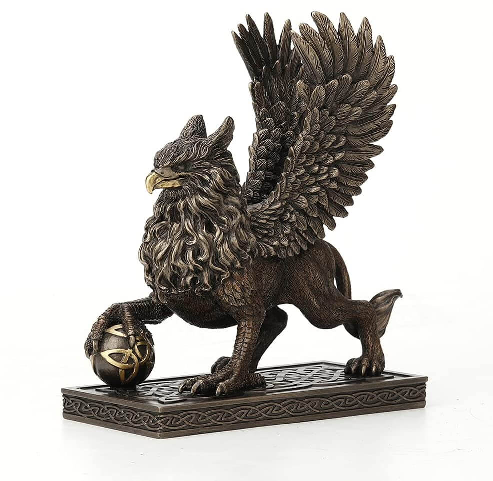 Griffin standing on a Celtic knot base, claw on a sphere with more knotwork