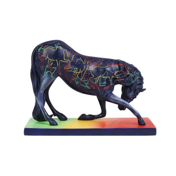 Trail of Painted Ponies horse, blue base with white star speckles. Rainbow designs mimicking horses, dogs, and cats. Horse is bowing down.