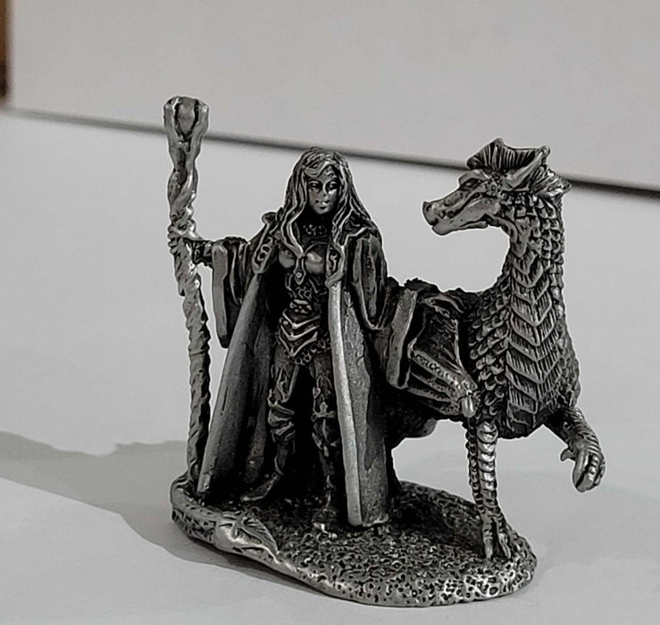 Pewter sorceress holding a staff, with her dragon friend