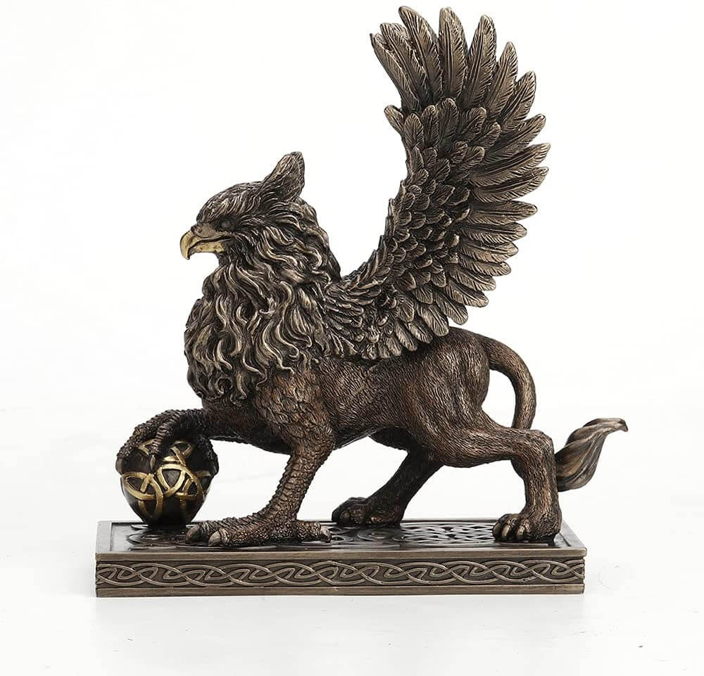 Griffin standing on a Celtic knot base, claw on a sphere with more knotwork