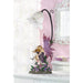 Orchid fairy lamp with delicate patterned shade sits in a pink and white decorated room