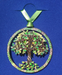 Tree of Life ornament with inspirational circle around it in shades of brass, gold, and green