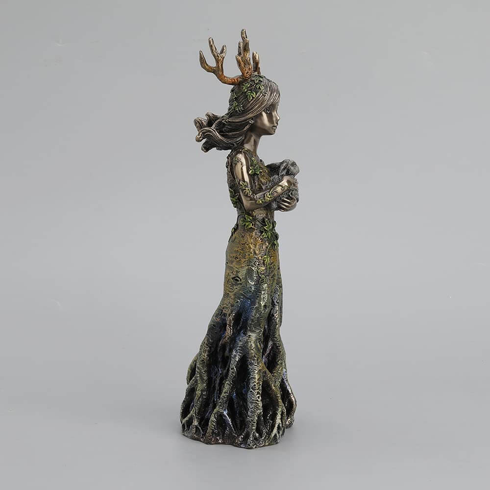 Side view of tree spirit holding rabbit