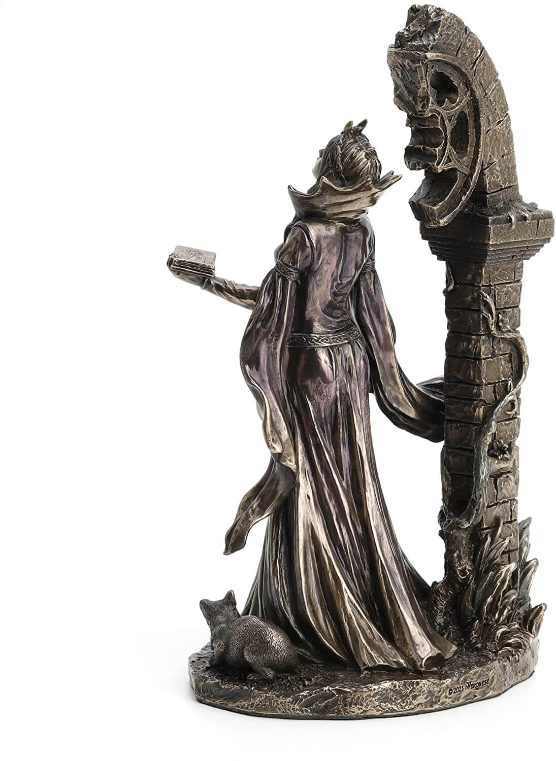 Back view - Aradia s represented standing with eyes closed, face tipped to the heavens. Her dress is long and flowy, and she holds a tome in one hand and an orb in the other. She stands in front of ruins twined with vining flowers.