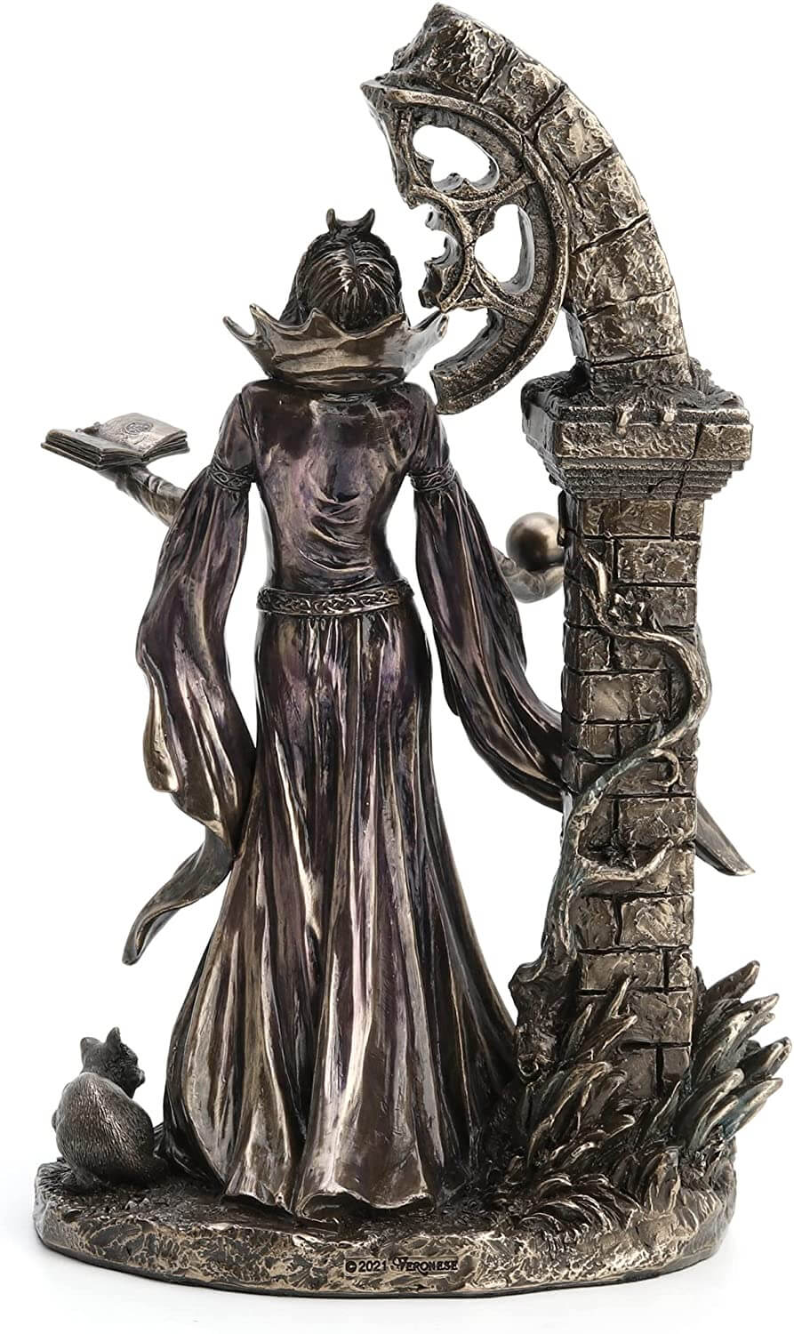 Back view - Aradia s represented standing with eyes closed, face tipped to the heavens. Her dress is long and flowy, and she holds a tome in one hand and an orb in the other. She stands in front of ruins twined with vining flowers.