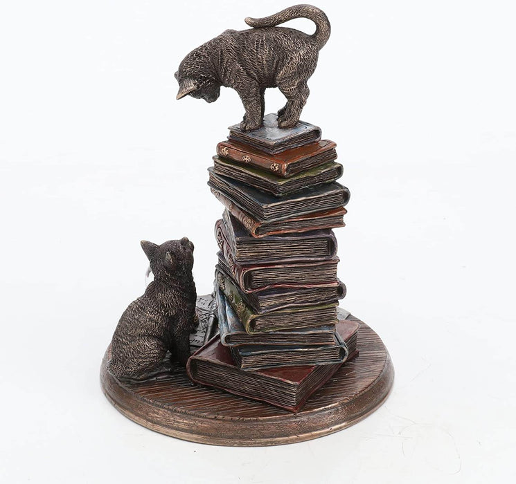 Moral High Ground figurine viewed from the side showing books and cats