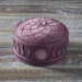 Pink-purple dreamcatcher themed trinket box accented with jewels. Shown on a wooden table