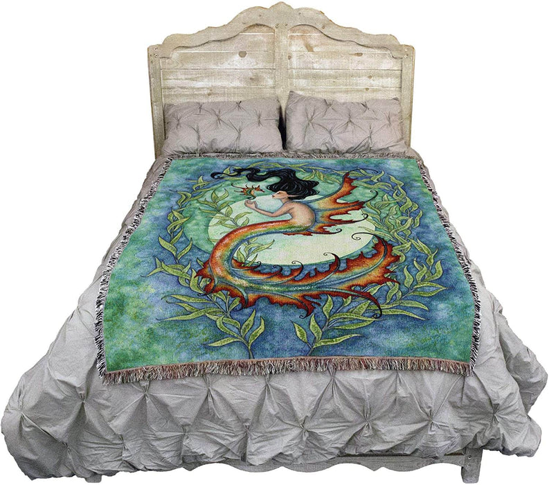 Exotic mermaid tapestry blanket shown on a bed