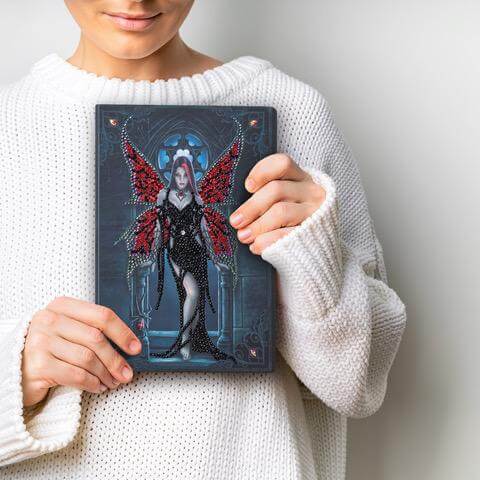 Arachnafaria journal crystal art set, finish product held up by a person