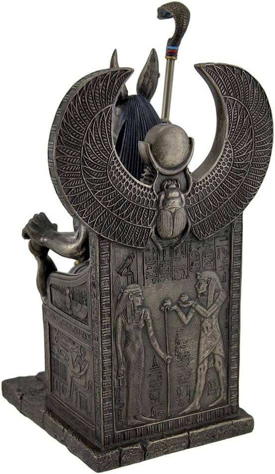 Back of the throne with Anubis seated in it, showing Egyptian hieroglyphs and depictions with a scarab