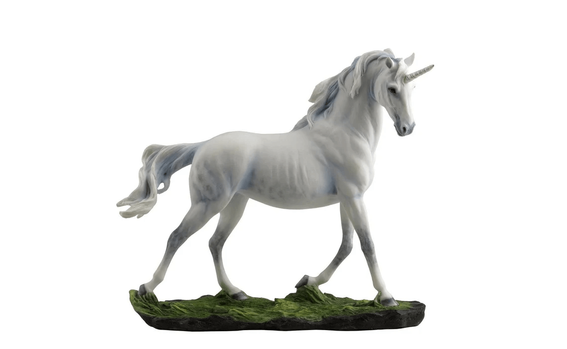 White unicorn trotting across mossy ground
