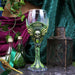 Absinthe goblet shown on display with other accessories