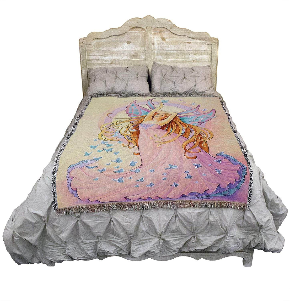 Butterfly Fairy tapestry blanket shown displayed on a bed