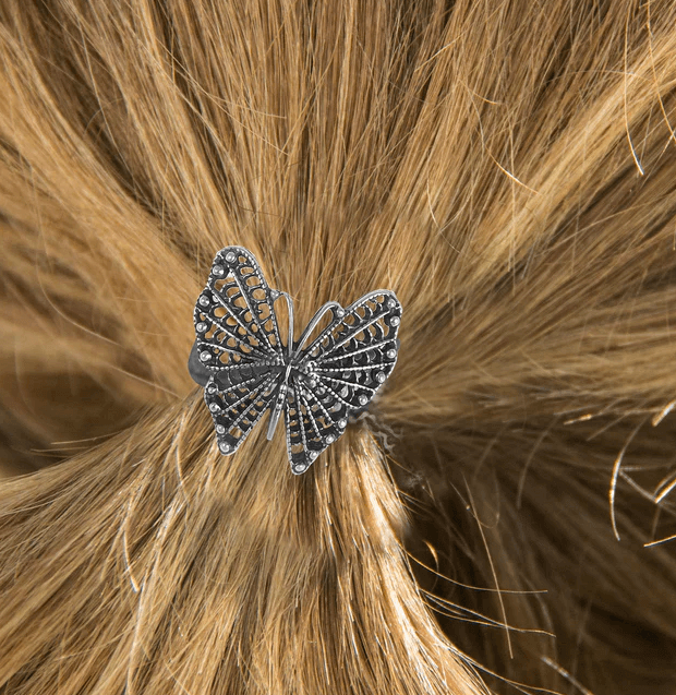 Pewter butterfly ponytail holder shown in hair