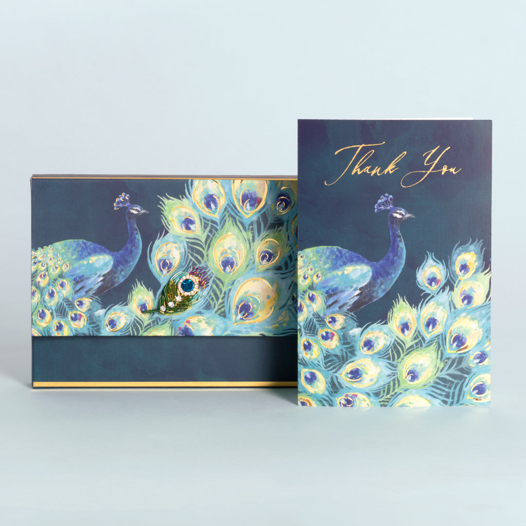 Thank you cards with gold foil accents and peacocks with fancy jeweled brooch box