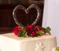 Celtic heart cake topper on top of wedding cake