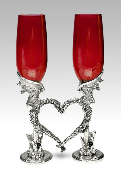 Red wedding dragon heart flutes nestling together in the shape of a heart