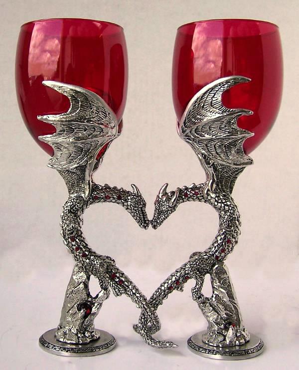 set of dragon wedding wine glass positioned to form a heart with dragons nuzzling and inlayed with gems